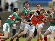 30 July 2005; Padraig McCourt, Armagh, is tackled by Paric O'Connor, left, Dermot O'Connor, and Ronan O'Boyle,right, Mayo. All-Ireland Minor Football Quarter-Final, Mayo v Armagh, Dr. Hyde Park, Roscommon. Picture credit; Matt Browne / SPORTSFILE