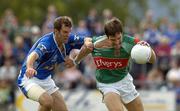 30 July 2005; Billy Joe Padden, Mayo, is tackled by Cathal Collins, Cavan. Bank of Ireland Football Championship qualifer, Round 4. Mayo v Cavan, Dr. Hyde Park, Roscommon. Picture credit; Matt Browne / SPORTSFILE