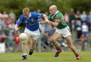 30 July 2005; Dermot McCabe, Cavan, is tackled by Shane Fitzmaurice, Mayo. Bank of Ireland Football Championship qualifer, Round 4. Mayo v Cavan, Dr. Hyde Park, Roscommon. Picture credit; Matt Browne / SPORTSFILE