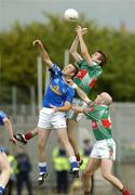 30 July 2005; Ronan McGarrity and Shane Fitzmaurice Mayo, contest a high ball with Paddy Brady, Cavan. Bank of Ireland Football Championship qualifer, Round 4. Mayo v Cavan, Dr. Hyde Park, Roscommon. Picture credit; Matt Browne / SPORTSFILE