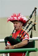 30 July 2005; Pa Hurley, from Mayfield, Cork, plays his bagpipes before the game. Bank of Ireland Football Championship qualifiers, Round 4. Cork v Sligo, O'Moore Park, Portlaoise, Co. Laois. Picture credit; Brendan Moran / SPORTSFILE