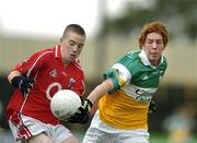 30 July 2005; Colm O'Neill, Cork is tackled by Diarmuid Horan, Offaly. All-Ireland Minor Football Championship Quarter Final, Cork v Offaly, O'Moore Park, Portlaoise, Co. Laois. Picture credit; Brendan Moran / SPORTSFILE