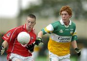 30 July 2005; Colm O'Neill, Cork is tackled by Diarmuid Horan, Offaly. All-Ireland Minor Football Championship Quarter Final, Cork v Offaly, O'Moore Park, Portlaoise, Co. Laois. Picture credit; Brendan Moran / SPORTSFILE