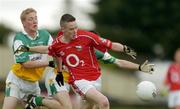 30 July 2005; Sean Kiely, Cork, is tackled by Stephen Lonergan and Gerry Grehan, Offaly. All-Ireland Minor Football Championship Quarter Final, Cork v Offaly, O'Moore Park, Portlaoise, Co. Laois. Picture credit; Brendan Moran / SPORTSFILE