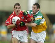 30 July 2005; Colm O'Driscoll, Cork is tackled by Gerry Grehan, Offaly. All-Ireland Minor Football Championship Quarter Final, Cork v Offaly, O'Moore Park, Portlaoise, Co. Laois. Picture credit; Brendan Moran / SPORTSFILE