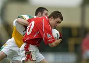 30 July 2005; Colm O'Driscoll, Cork is tackled by Gerry Grehan, Offaly. All-Ireland Minor Football Championship Quarter Final, Cork v Offaly, O'Moore Park, Portlaoise, Co. Laois. Picture credit; Brendan Moran / SPORTSFILE