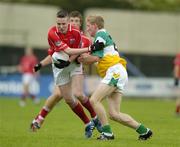 30 July 2005; Sean Kiely, Cork is tackled by Stephen Lonergan, Offaly. All-Ireland Minor Football Championship Quarter Final, Cork v Offaly, O'Moore Park, Portlaoise, Co. Laois. Picture credit; Brendan Moran / SPORTSFILE