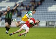 30 July 2005; David Kearney, Cork is tackled by James Guinan, Offaly. All-Ireland Minor Football Championship Quarter Final, Cork v Offaly, O'Moore Park, Portlaoise, Co. Laois. Picture credit; Brendan Moran / SPORTSFILE