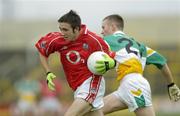 30 July 2005; Rickey Kenny, Cork is tackled by Gerry Treacy, Offaly. All-Ireland Minor Football Championship Quarter Final, Cork v Offaly, O'Moore Park, Portlaoise, Co. Laois. Picture credit; Brendan Moran / SPORTSFILE