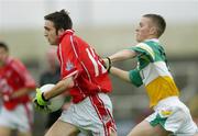 30 July 2005; Rickey Kenny, Cork is tackled by Gerry Treacy, Offaly. All-Ireland Minor Football Championship Quarter Final, Cork v Offaly, O'Moore Park, Portlaoise, Co. Laois. Picture credit; Brendan Moran / SPORTSFILE