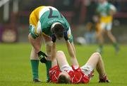 30 July 2005; Alan Barry, Cork is consoled by Ross Brady, Offaly, after the final whistle. All-Ireland Minor Football Championship Quarter Final, Cork v Offaly, O'Moore Park, Portlaoise, Co. Laois. Picture credit; Brendan Moran / SPORTSFILE