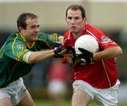 30 July 2005; Vincent Hurley, Cork is tackled by Stephen Dillon, Meath. All-Ireland Junior Football Final, Cork v Meath, O'Moore Park, Portlaoise, Co. Laois. Picture credit; Brendan Moran / SPORTSFILE