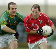 30 July 2005; Vincent Hurley, Cork is tackled by Stephen Dillon, Meath. All-Ireland Junior Football Final, Cork v Meath, O'Moore Park, Portlaoise, Co. Laois. Picture credit; Brendan Moran / SPORTSFILE
