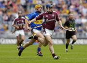 31 July 2005; David Forde, Galway is tackled by Eamonn Corcoran, Tipperary. Guinness All-Ireland Hurling Championship, Quarter-Final, Galway v Tipperary, Croke Park, Dublin. Picture credit; Damien Eagers / SPORTSFILE