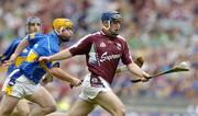 31 July 2005; David Forde, Galway is tackled by Eamonn Corcoran, Tipperary. Guinness All-Ireland Hurling Championship, Quarter-Final, Galway v Tipperary, Croke Park, Dublin. Picture credit; Damien Eagers / SPORTSFILE