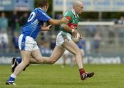 30 July 2005; Shane Fitzmaurice, Mayo, is tackled by Paddy Brady, Cavan. Bank of Ireland Football Championship qualifer, Round 4. Mayo v Cavan, Dr. Hyde Park, Roscommon. Picture credit; Matt Browne / SPORTSFILE