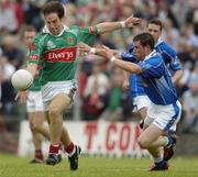 30 July 2005; Billy Joe Padden of Mayo is tackled by Finbar O'Reilly of Cavan during the GAA All-Ireland Football Championship Qualifer, Round 4 match between Mayo and Cavan at Dr Hyde Park in Roscommon. Photo by Matt Browne/Sportsfile