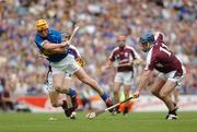 31 July 2005; Eamonn Corcoran, Tipperary is tackled by David Forde, Galway. Guinness All-Ireland Hurling Championship, Quarter-Final, Galway v Tipperary, Croke Park, Dublin. Picture credit; David Levingstone / SPORTSFILE