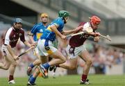 31 July 2005; Alan Kerins, Galway supported by team-mate Damien Hayes is tackled by Declan Fanning, Tipperary. Guinness All-Ireland Hurling Championship, Quarter-Final, Galway v Tipperary, Croke Park, Dublin. Picture credit; David Levingstone / SPORTSFILE