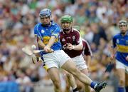 31 July 2005; Eoin Kelly, Tipperary, scores a point under pressure from Galway's Ollie Canning. Guinness All-Ireland Senior Hurling Championship Quarter-Final, Galway v Tipperary, Croke Park, Dublin. Picture credit; Ray McManus / SPORTSFILE