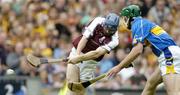 31 July 2005; Damien Hayes, Galway, scores his sides second goal despite the challenge of Declan Fanning, Tipperary. Guinness All-Ireland Hurling Championship, Quarter-Final, Galway v Tipperary, Croke Park, Dublin. Picture credit; Brendan Moran / SPORTSFILE