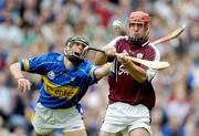 31 July 2005; Alan Kerins, Galway, keeps his eyes on the sliotar despite the challenge of Hugh Moloney, Tipperary. Guinness All-Ireland Hurling Championship, Quarter-Final, Galway v Tipperary, Croke Park, Dublin. Picture credit; Brendan Moran / SPORTSFILE