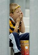 31 July 2005; Young Kilkenny supporter Jack Hawe, age 5, from Kilkenny, enjoys his popcorn during the game. Guinness All-Ireland Hurling Championship, Quarter-Final, Kilkenny v Limerick, Croke Park, Dublin. Picture credit; Brendan Moran / SPORTSFILE