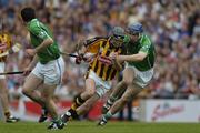 31 July 2005; DJ Carey, Kilkenny, is tackled by Stephen Lucey, Limerick. The referee gave a free against DJ Carey for over carrying the sliothar. Guinness All-Ireland Senior Hurling Championship Quarter-Final, Kilkenny v Limerick, Croke Park, Dublin. Picture credit; Ray McManus / SPORTSFILE