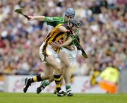 31 July 2005; DJ Carey, Kilkenny, is tackled by Stephen Lucey, Limerick. THe referee gave a free against DJ Carey for over carrying the sliothar. Guinness All-Ireland Senior Hurling Championship Quarter-Final, Kilkenny v Limerick, Croke Park, Dublin. Picture credit; Ray McManus / SPORTSFILE
