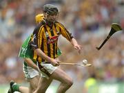 31 July 2005; Martin Comerford, Kilkenny solos through as Limerick's Paul O'Grady throws his hurley at him. Guinness All-Ireland Hurling Championship, Quarter-Final, Kilkenny v Limerick, Croke Park, Dublin. Picture credit; Damien Eagers / SPORTSFILE