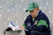 31 July 2005; Conor O'Brien, from Mungret, Co Limerick, reads his programme before the game. Guinness All-Ireland Senior Hurling Championship Quarter-Final, Kilkenny v Limerick, Croke Park, Dublin. Picture credit; Ray McManus / SPORTSFILE