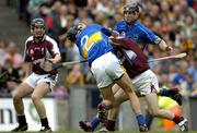 31 July 2005; Damien Hayes, Galway, holds off the challenge of Hugh Moloney (2), Tipperary, on his way to scoring his sides second goal. Guinness All Ireland Hurling Championship, Quarter Final, Galway v Tipperary, Croke Park, Dublin. Picture credit; Brendan Moran / SPORTSFILE