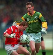 25 April 1999; Aidan Dorgan of Cork is tackled by Donal Curtis of Meath during the Church and General National Football League Semi-Final match between Cork and Meath at Croke Park in Dublin. Photo by Ray McManus/Sportsfile