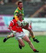 25 April 1999; Aidan Dorgan of Cork is tackled by Donal Curtis of Meath during the Church and General National Football League Semi-Final match between Cork and Meath at Croke Park in Dublin. Photo by Aoife Rice/Sportsfile