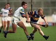 18 April 1999; Aidan Ryan of Tipperary is tackled by Tony Browne of Waterford during the Church and General National Hurling League Division 1B match between Tipperary and Waterford at Semple Stadium in Thurles, Tipperary. Photo by Brendan Moran/Sportsfile