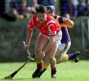 18 April 1999; Alan Browne of Cork in action against Liam Dunne of Wexford during the Church & General National Hurling League Division 1B match between Wexford and Cork at Páirc Uí Shíocháin in Gorey, Wexford. Photo by Ray McManus/Sportsfile
