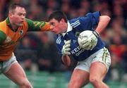 11 April 1999; Aodán MacGearailt of Kerry in action against Jimmy McGuinness of Meath during the Church & General National Football League Division 1 Quarter-Final match between Kerry and Meath at the Gaelic Grounds in Limerick. Photo by Brendan Moran/Sportsfile