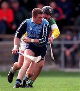10 April 1999; Barry O'Sullivan of Dublin in action against Johnny Dooley of Offaly during the Church & General National Hurling League Division 1A match between Offaly and Dublin at St Brendan's Park in Birr, Offaly. Photo by Ray McManus/Sportsfile