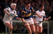 18 April 1999; Brian O'Meara of Tipperary in action against Fergal Hartley of Waterford during the Church and General National Hurling League Division 1B match between Tipperary and Waterford at Semple Stadium in Thurles, Tipperary. Photo by Brendan Moran/Sportsfile