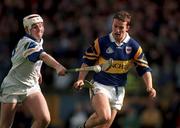 18 April 1999; Brian O'Meara of Tipperary in action against Fergal Hartley of Waterford during the Church and General National Hurling League Division 1B match between Tipperary and Waterford at Semple Stadium in Thurles, Tipperary. Photo by Brendan Moran/Sportsfile