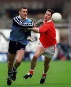 25 April 1999; Ciaran Whelan of Dublin in action against Paul McGrane of Armagh during the Church & General National Football League Division 1 Semi-Final match between Armagh and Dublin at Croke Park in Dublin. Photo by Ray McManus/Sportsfile