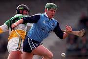 10 April 1999; Conor McCann of Dublin in action against Johnny Dooley of Offaly during the Church & General National Hurling League Division 1A match between Offaly and Dublin at St Brendan's Park in Birr, Offaly. Photo by Ray McManus/Sportsfile