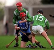 4 April 1999; Darragh Spain of Dublin in action against Brian Geary and James Butler of Limerick during the Church & General National Hurling League Division 1A match between Dublin and Limerick at Parnell Park in Dublin. Photo by Ray McManus/Sportsfile
