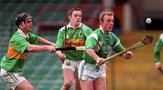 11 April 1999; Dave Clarke of Limerick in action against Ian Maunsell, left, and Michael O'Regan of Kerry during the Church & General National Hurling League Division 1A match between Limerick and Kerry at the Gaelic Grounds in Limerick. Photo by Brendan Moran/Sportsfile