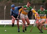 10 April 1999; David Sweeney of Dublin in action against Michael Duignan, centre, and Brian Whelahan of Offaly during the Church & General National Hurling League Division 1A match between Offaly and Dublin at St Brendan's Park in Birr, Offaly. Photo by Ray McManus/Sportsfile