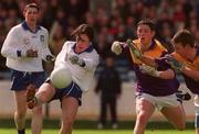 18 April 1999; Declan Newell of St Jarlath's in action against Robert Magee and Niall Murphy of Good Counsel during GAA All-Ireland Post Primary Senior A Schools Football Hogan Cup Final match between St Jarlath's Tuam, Galway and Good Counsel New Ross, Wexford at Croke Park in Dublin. Photo by Matt Browne/Sportsfile