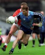 25 April 1999; Dessie Farrell of Dublin is tackled by Kieran McGeeney of Armagh during the Church & General National Football League Division 1 Semi-Final match between Armagh and Dublin at Croke Park in Dublin. Photo by Ray McManus/Sportsfile