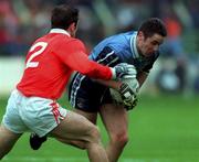 25 April 1999; Enda Sheedy of Dublin is tackled by Enda McNulty of Armagh during the Church & General National Football League Division 1 Semi-Final match between Armagh and Dublin at Croke Park in Dublin. Photo by Ray McManus/Sportsfile