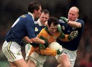 11 April 1999; Hank Traynor of Meath in action against Donal Daly, left, and Liam O'Flaherty of Kerry during the Church & General National Football League Division 1 Quarter-Final match between Kerry and Meath at the Gaelic Grounds in Limerick. Photo by Brendan Moran/Sportsfile