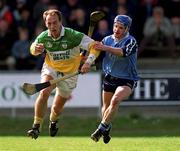 10 April 1999; Joe Dooley of Offaly in action against John Flanagan of Dublin during the Church & General National Hurling League Division 1A match between Offaly and Dublin at St Brendan's Park in Birr, Offaly. Photo by Ray McManus/Sportsfile